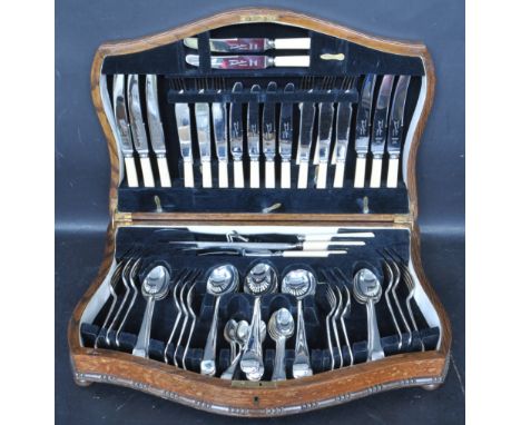 A vintage mid 20th century Bennett &amp; Heron six person stainless steel canteen of cutlery. Set within an oak case. Measure