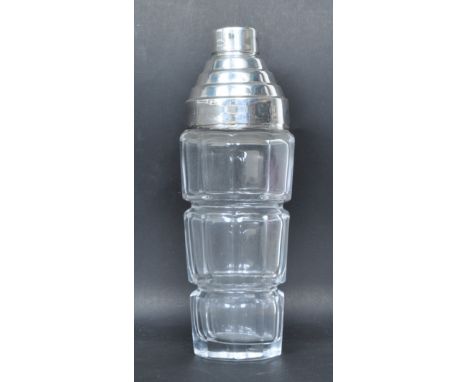 A vintage style heavy molded glass and stepped silver plated cocktail shaker. Measures 28cm tall. Good condition.&nbsp;