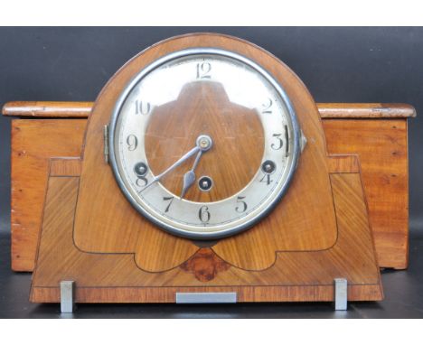An early 20th century circa 1930s Art Deco eight day Westminster chime mantel clock together with an early 20th century till.