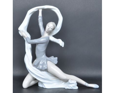 A 20th century Spanish Nao ceramic porcelain figurine of a dancing ballerina entitles the 'Dancer With Veil'. Makers mark to 