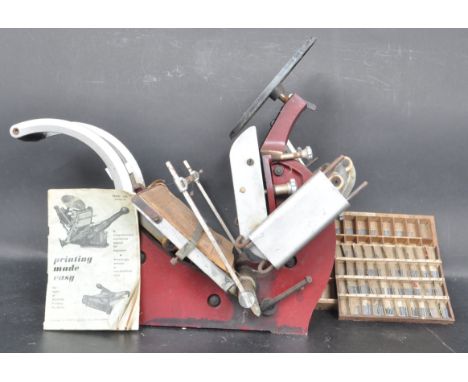 A vintage mid 20th Century printing press and related equipment. The lot to include&nbsp;a collection of type metal letter se