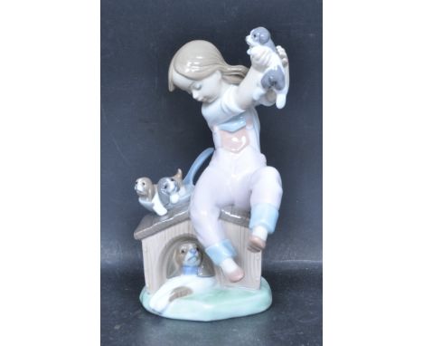 A ceramic porcelain Spanish Lladro figure entitled 'Pick Of The Litter'. Figurine model number 7621. Complete with original p