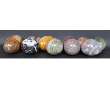 A collection of vintage 20th century specimen polished stone eggs comprising of rouge marble, carnelian, onyx, granite, Sienn