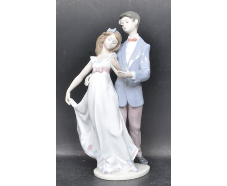 A ceramic porcelain Spanish Lladro figurine entitled 'Now And Forever' depicting a dancing couple. Figure model number 7642. 