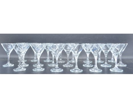 A collection of twenty-two vintage retro 20th century Babycham glasses. The collection include fifteen twisted stem glasses r