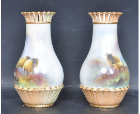 Two early 20th century Edwardian Royal Worcester porcelain vases having flared pierced rims with gilt edging, finely hand pai