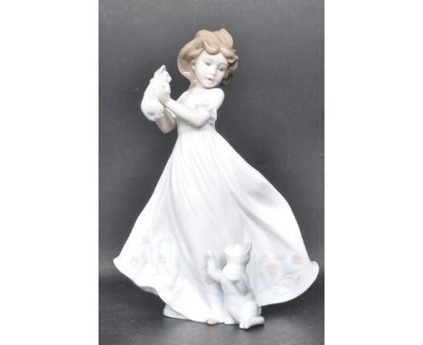 A ceramic porcelain Spanish Lladro figure entitled 'Kittens Gathering'. Figurine model number 6941 / 010.06941. Complete with