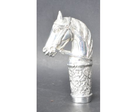 A vintage style walking cane handle in the form of a horses head stamped 800 to the rear. Having a bridal and floral decorati
