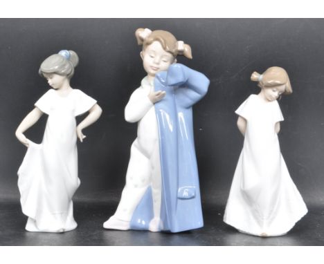 A group of three ceramic porcelain Spanish Nao by Lladro figures entitled 'How Pretty' figurine model number 1110, 'So Shy' f