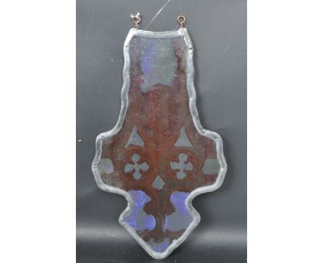 A vintage 20th century lead framed stained glass fragment in the form of a cross having Gothic images to both sides.&nbsp; Me
