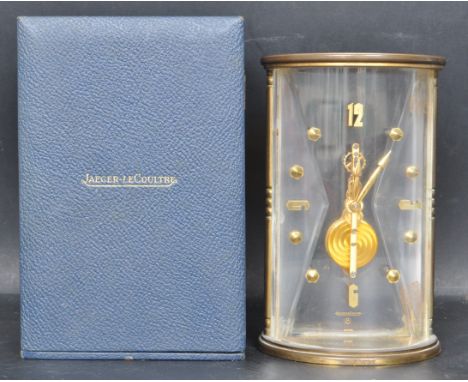 A mid 20th century&nbsp;Jaeger-Le-Coultre 8 Swiss mantle clock. The brass and plexiglass clock of a cylindrical form having b