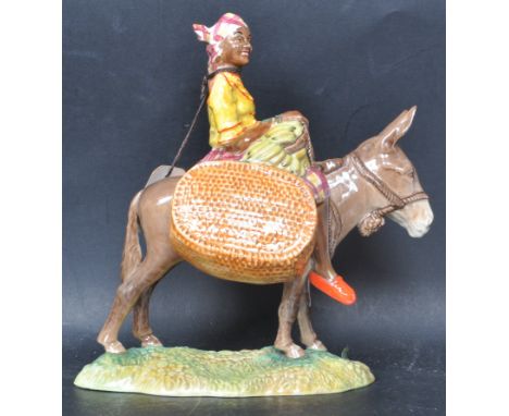 A vintage 20th century ceramic porcelain Beswick " Susie Jamaica " figurine depicting a girl riding a donkey, model No. 1347.