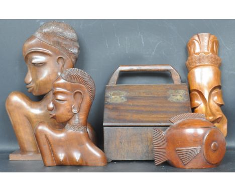 A collection of vintage 20th century hardwood African figurines to include a wooden bust table lamp base, two wall hanging Af