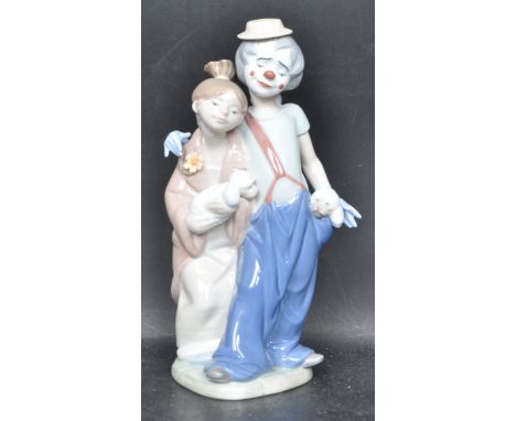 A ceramic porcelain Spanish Lladro collectors Society 2000 figure entitled 'Pals Forever'. Figurine model number 7686. Comple