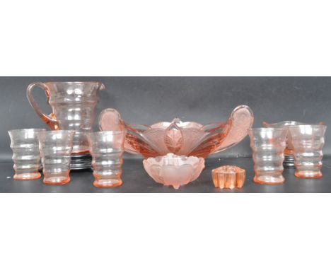 A collection of vintage retro early 20th century Art Deco orange pressed glass. The collection comprising of a lemonade set (