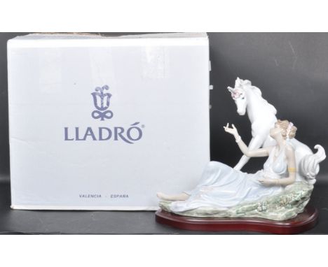 A large vintage 20th century Lladro Goddess &amp; Unicorn porcelain figurine raised on a wooden base. 6007. Makers stamp to t