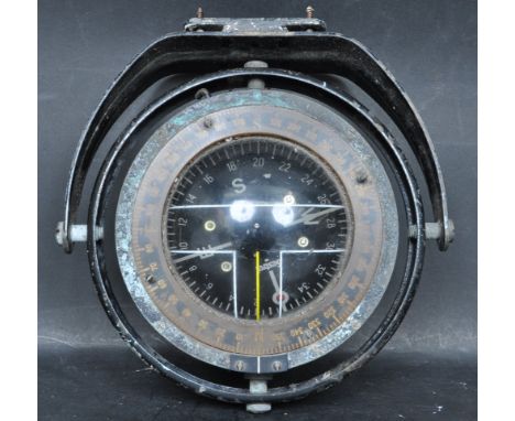 A vintage retro 20th century nautical Sestrel gimbal ships deck compass, within the original circular surround. The dial stam