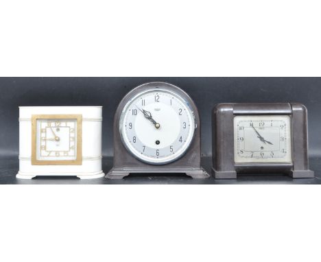 A collection of two early 20th century and later Bakelite Art Deco mantel clocks by Smiths and Timlec. One having an archtop 