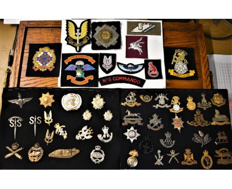 A collection of (50) Cap Badges and Cloth Patches, Some Original and Some Restrikes within this collection. SAS, Yorkshire Re