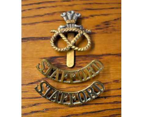 Staffordshire Regiment (Prince of Wales's) Cap Badge and pair of Shoulder Titles. K&amp;K: 2050 worn 1959 onward.