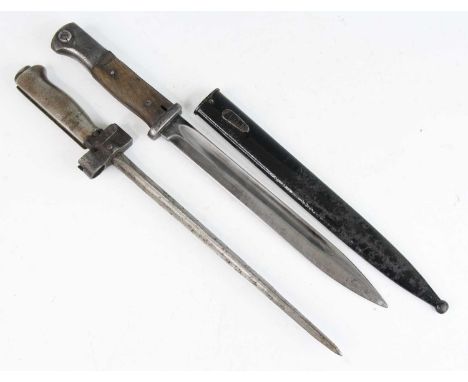 A German Model 84/98 Mauser bayonet, having a 25cm single edged fullered blade, the steel crossguard numbered 4302, the two p