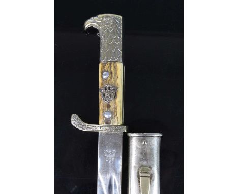 A German Third Reich Polizei side-arm, having a 33cm fullered blade marked to the ricasso Alexander Coppel Solingen and with 