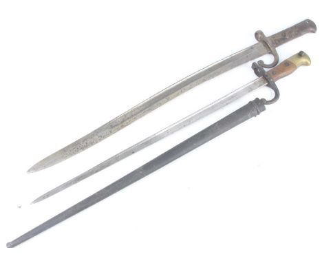 A French Model 1874 Gras bayonet, the 52.5cm blade inscribed to the back edge Mre d' armes de St Ettienne Chat 1879, having a