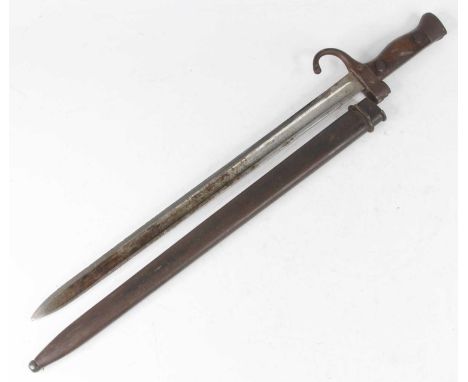 A French M1892 Berthier bayonet, having a 39.5cm fullered blade, the hooked quillon stamped 873804 with riveted two piece gri