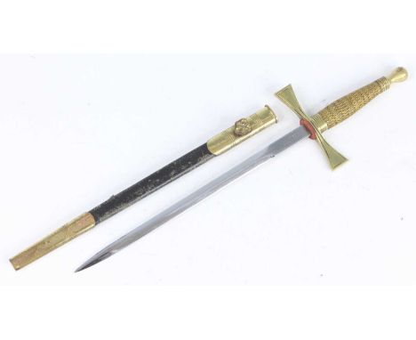 A Masonic ceremonial dagger, the 23.5cm blade etched Wilkinson Pall Mall, having a brass crossguard and wire bound grip, hous