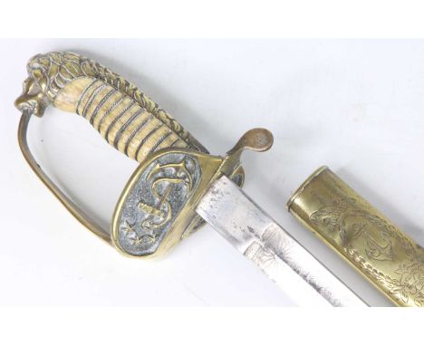 An early 20th century Turkish Naval sword, having a 79cm slightly curved blade etched with stands of arms and a crescent and 