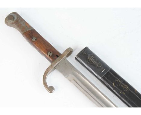 A Brazilian 1908/34 pattern Mauser bayonet, having a 38cm single edged fullered blade, the hooked quillon numbered 4852 O U w