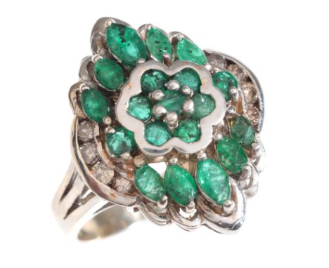 AN EMERALD AND DIAMOND CLUSTER RING in 14ct white gold, set with a cluster of round cut and marquise cut emeralds and round b