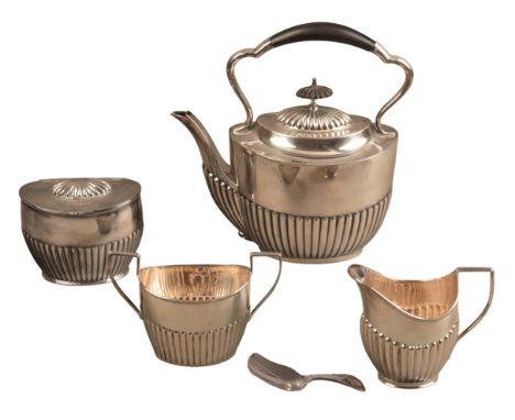 AN EDWARD VII SILVER THREE PIECE HARLEQUIN 'TEA SERVICE'with oval part gadrooned bodies, comprising tea kettle, cream jug and