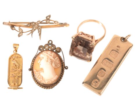 A COLLECTION OF JEWELLERYincluding a smoky quartz cocktail ring in 9ct gold, an antique swallow bar brooch in 15ct gold set w