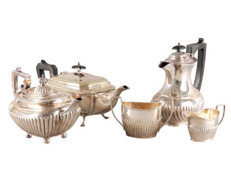 A VICTORIAN AND EDWARD VII SILVER HARLEQUIN TEA SERVICEwith part gadrooned bodies, comprising teapot by James Dixon & Sons, S