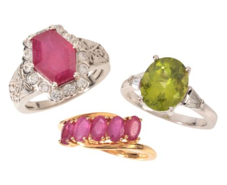 THREE GEM-SET RINGSincluding a ruby ring in sterling silver, set with a step cut glass-filled ruby in a border of round cut w