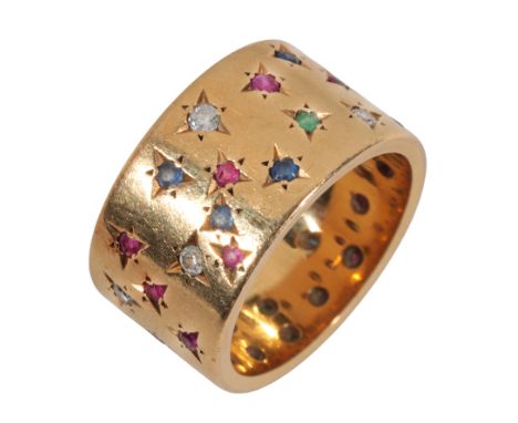 KUTCHINSKY: A VINTAGE MULTI-GEM BANDin 18ct gold, set throughout with round cut rubies, sapphires, emeralds and diamonds, all