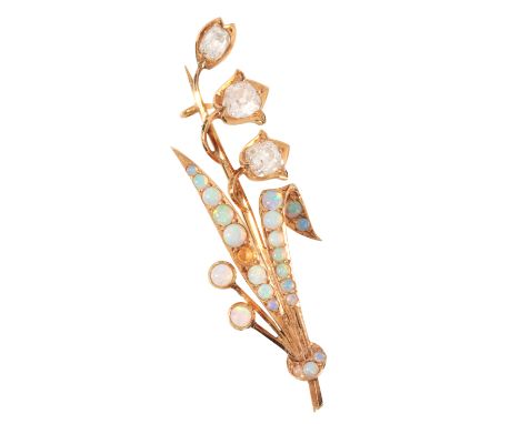 A LILY OF THE VALLEY OPAL AND DIAMOND BROOCHin 18ct gold, set with three old mine cut diamonds totalling c.1.18 carats, accen