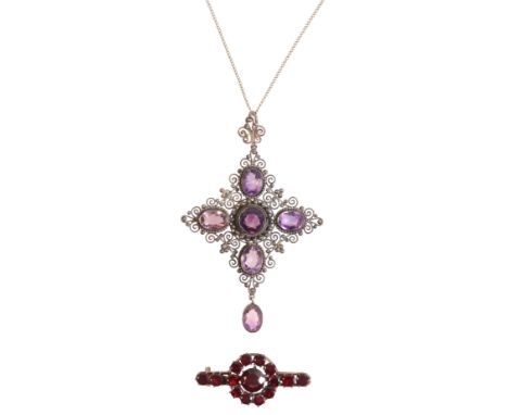 AN AMETHYST PENDANT NECKLACEin sterling silver, set with five amethysts over a stylised design, suspending an amethyst drop, 