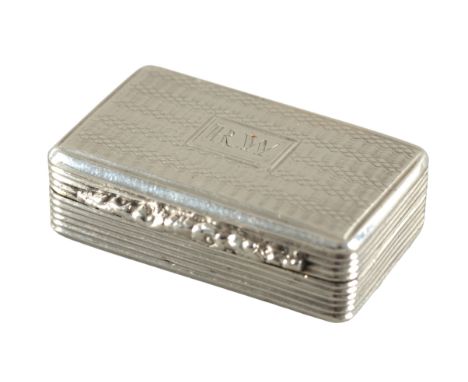 A GEORGE IV SILVER VINAIGRETTEpossibly by Thomas Shaw, Birmingham 1824, with engine turned lid and base, reeded sides and flo