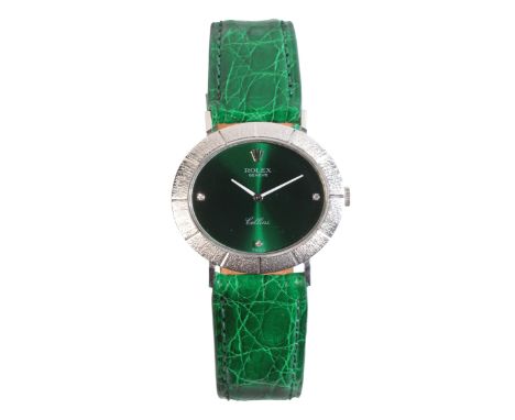 ROLEX CELLINI: A LADY'S 18CT WHITE GOLD WRISTWATCHwith manual wind movement, the oval green dial with diamanté hour markers a