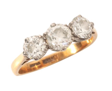 A DIAMOND THREE STONE RINGin 18ct gold and platinum, set with three graduated old European cut diamonds totalling c.1.20 cara