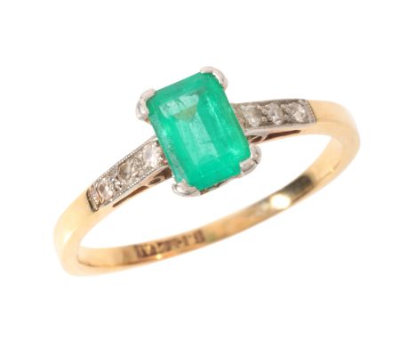 AN EMERALD AND DIAMOND RINGin 18ct gold and platinum, set with a step cut emerald of c.0.70 carats, to diamonds-set shoulders