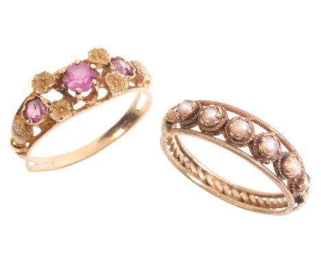 TWO GEM-SET RINGSincluding a ruby three stone ring in 18ct gold, set with three round cut rubies over a stylised design with 