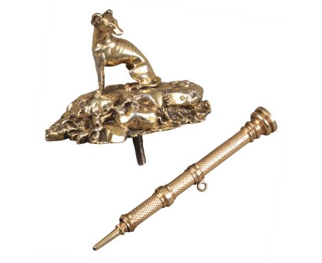 A 19TH CENTURY GILDED WHITE METAL FINIAL possibly a trophy mounted, finely cast with seated greyhound atop rocky outcrop, 4cm