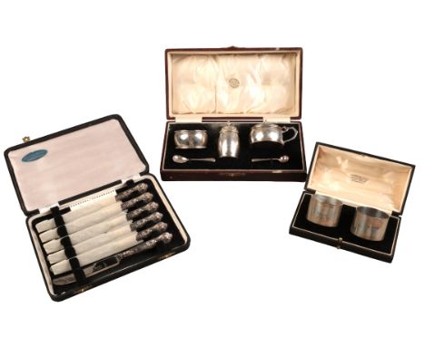 A GEORGE V SILVER CONDIMENT SETby William Neale & Co, Birmingham 1930; together with two silver napkin rings, Birmingham 1910