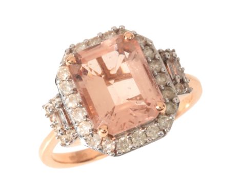 A MORGANITE AND DIAMOND RINGin 14ct rose gold, set with a step cut morganite of c.2.95 carats, in a border of round brilliant