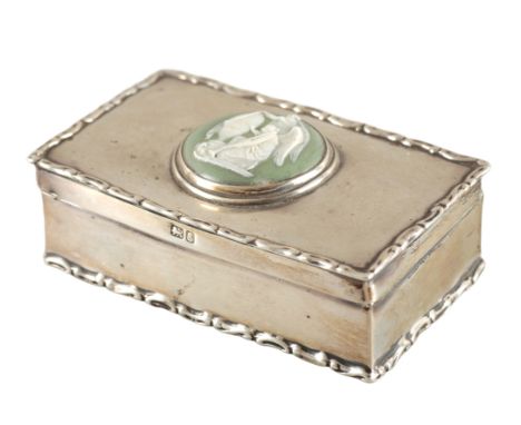 A GEORGE V SILVER TRINKET BOXby Carrington & Co, Chester 1905, of plain rectangular form with cast scroll rims, the lid set w