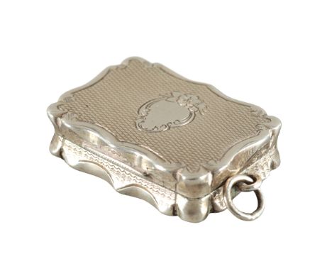 A VICTORIAN SILVER VINAIGRETTEby James Fenton, Birmingham 1862, the shaped rectangular body with engine turned engraving, rin