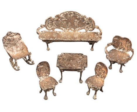 A SET OF AMERICAN STERLING SILVER DOLLS HOUSE FURNITURE marked "Sterling", consisting of three chairs, one rocking chair tabl